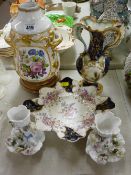 Handpainted twin handled vase, a floral painted lamp base, a pair of winged cherub decorated