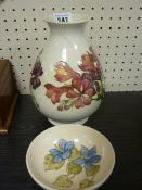 Moorcroft tulip decorated vase, 19 cms tall A/F and a Moorcroft shallow pedestal bowl, 11.5 cms