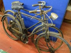 Two vintage bicycles, one Raleigh with steel tubing, three speed gears and Dynamo lighting system
