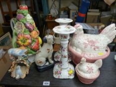 Two pottery hen on nests, a pair of floral decorated candlesticks, a modern seated dog figurine etc