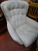 Faux leather light grey egg shaped designer chair by Sesselkissen with metal swivel base