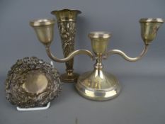 Small silver candelabra and a floral decorated trumpet vase (both loaded) along with a pierced bon