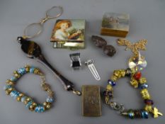 Good brass stamp case registered August 7, 1874, a painted top boxwood example, a miniature silver