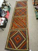 Suzni Kelim carpet runner, multi-coloured in four repeating block patterns with sectional borders,