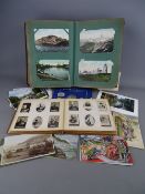 Vintage postcard album, an Ogden's Cigarettes photo album and a 1953 Westminster UK coin collection,
