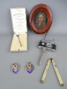 Miniature portrait on copper of a period gent, a miniature camera on stand table lighter and E