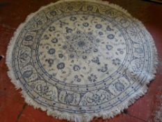 Circular light coloured rug 150 cms diameter