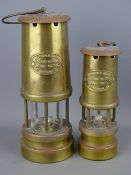 Two brass miner's lamps, 22 and 18 cms high, marked 'Ferndale Coal & Mining Company'