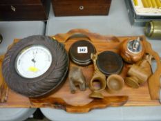 Wooden tray and contents including a wooden framed barometer, a carved wooden bear and other items