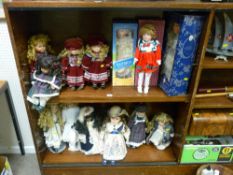 Large quantity of boxed and unboxed display dolls, some on stands
