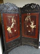 Japanese Meiji-period folding hardwood screen carved with birds, foliage with twin panels of bone