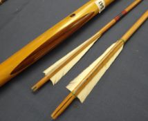 A modern crafted yew longbow with two arrows with blue denim case Condition reports provided on