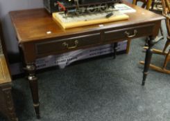 Victorian mahogany two-drawer writing table / desk raised on four turned tapering legs, 121cms
