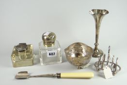 A parcel of silver comprising oval four-section toast rack on bun feet with loop handle, silver