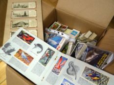 A box containing a large quantity of Brook Bond pictorial tea cards and including album sets and