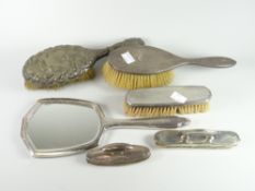 A matching machine turned silver backed dressing table mirror and brush, two further silver backed