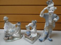 Three Lladro figures one being a South American lady in traditional costume seated with child,