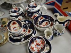 A quantity of Gaudy Welsh teaware including teapot and sucrier together with Gaudy Welsh jugs