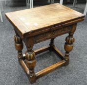An unusual antique reproduction modular oak coffee table on carved bulbous supports Condition