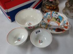 A nineteenth century Chinese footed rice bowl, two similar tea bowls and a Moore Brothers Japan