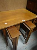 A mid-century nest of tables with the four smaller tables folding out Condition reports provided