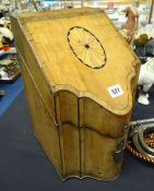 A nineteenth century serpentine-front cross banded mahogany knife box, the sloped lid hinging to