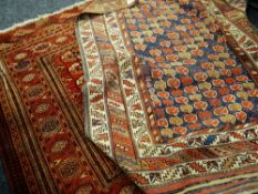 Two Persian red ground rugs geometric borders, 174 x 124cms & 116 x 138cms Condition reports