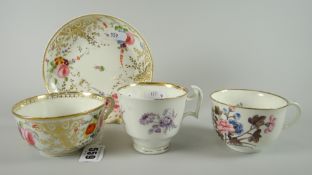 A Swansea porcelain shallow breakfast cup & saucer decorated profusely with gilding and sprays of