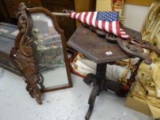 An Indonesian carved hexagonal occasional table, four reproduction carved furniture finials and a