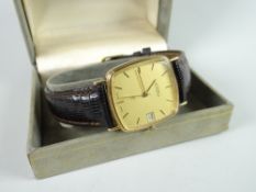 Roamer gents wristwatch in hallmarked yellow gold encasement, yellow dial and with date aperture,
