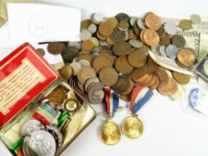 A good parcel of commemorative and loose coinage together with a tin of medals and medallions