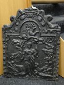 A believed Victorian cast iron fire back relief decorated with figurine in a landscape and later