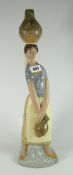 A Lladro pottery model of a water carrying female with vessel on her head, 47cms high Condition