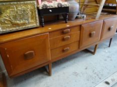 A mid-century teak long sideboard together with a reproduction serpentine sideboard Condition