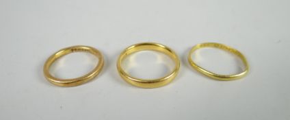 Three 22ct yellow gold wedding bands, 8grams Condition reports provided on request by email for this