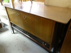 A retro mixed wood mid-century sideboard with two drawers and two cupboards 132cms wide Condition