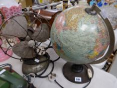 A vintage terrestrial spinning table globe and a vintage electric desk fan by Frost (distressed)