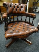 Twentieth century leather button back captain's swivel office chair Condition reports provided on
