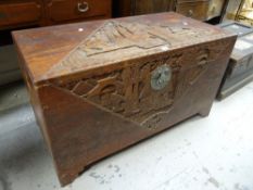 An Oriental carved camphorwood chest Condition reports provided on request by email for this auction
