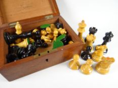 A vintage wooden boxed set of carved chess pieces inscription to the box 'R Whitty, Liverpool' (