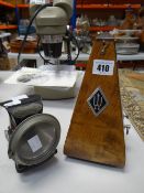 A vintage metronome and a Lucas Silver King carbide motoring lamp Condition reports provided on