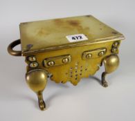 A miniature antique brass footman with twin handles, 23cms wide Condition reports provided on