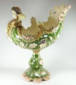 An imposing Majolica-style continental pottery table centrepiece with cherubic head and with