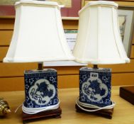 A pair of modern decorative Chinese-style blue & white table lamps of square based form on