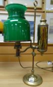 A vintage brass reading oil lamp with elevated side reservoir and green glass shade Condition
