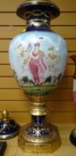 A twentieth century oversized floor vase with lid decorated with an all round garden scene of