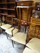A set of six reproduction mahogany cushion seated dining chairs, a single dining chair with splat