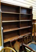 A tall stained wood waterfall bookcase, 185cms high Condition reports provided on request by email