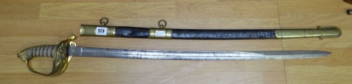 An antique British Naval Officer's sword having wire bound fish grip handle with lion's head pommel,