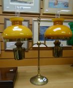 A vintage brass twin-branch reading oil lamp Condition reports provided on request by email for this